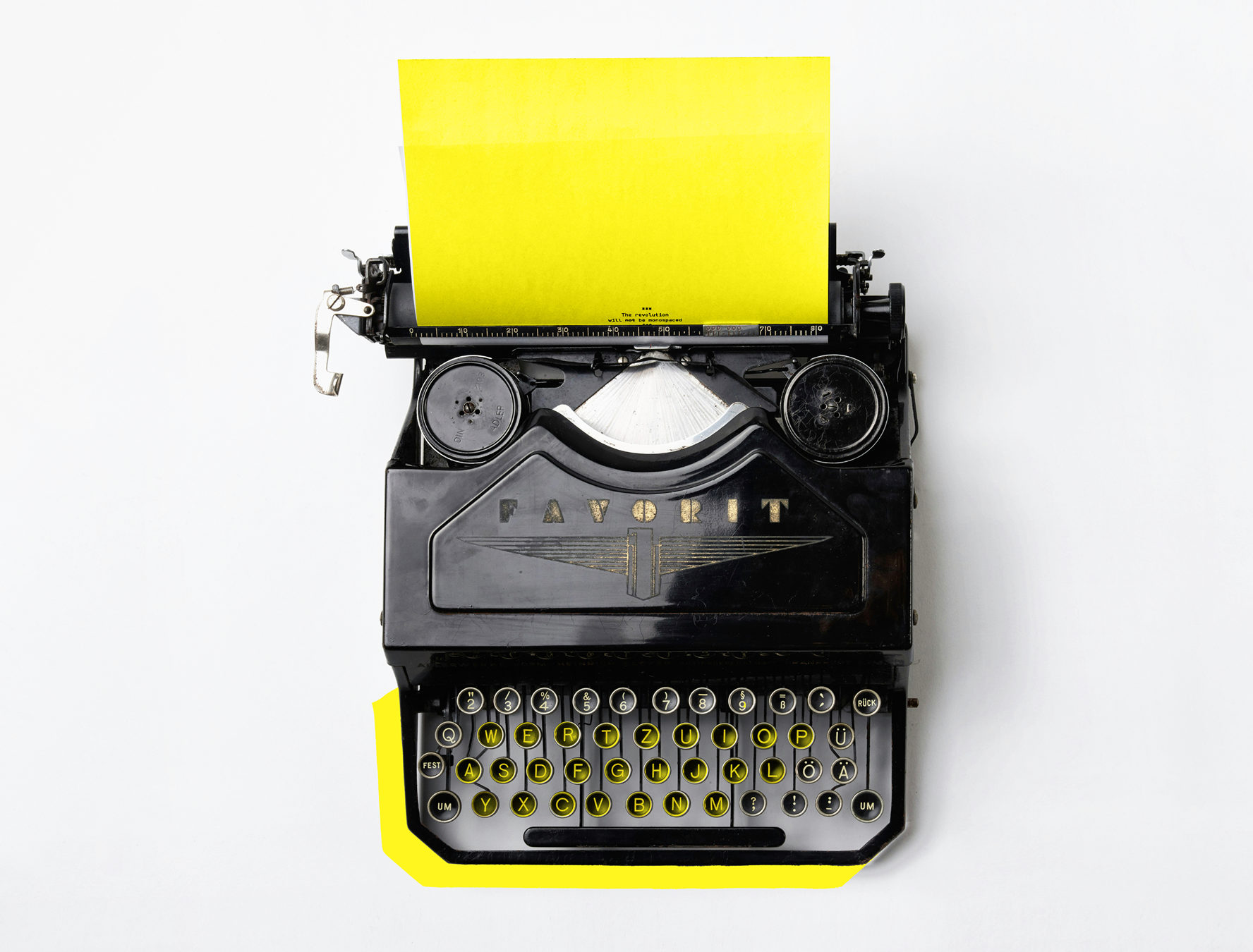 Typewriter with yellow paper